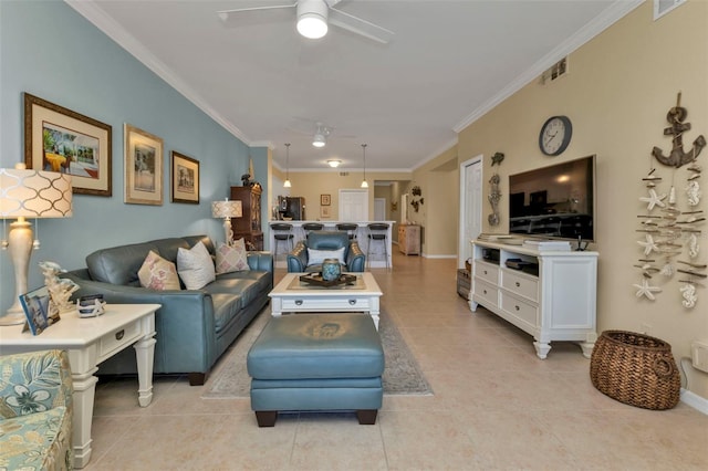 tiled living room with ceiling fan and ornamental molding