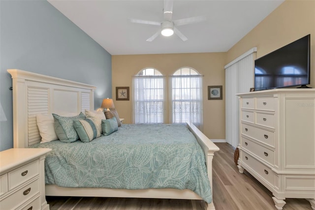 bedroom with light wood-type flooring and ceiling fan