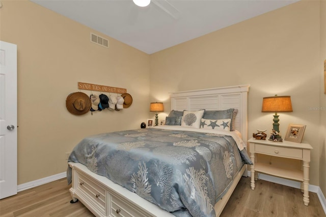 bedroom with ceiling fan and light hardwood / wood-style floors