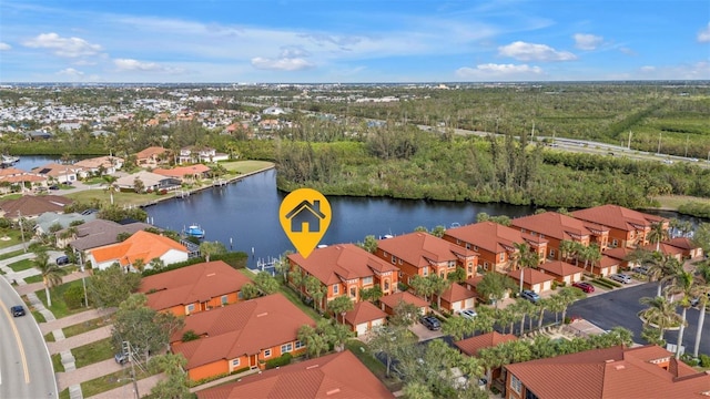 birds eye view of property with a water view