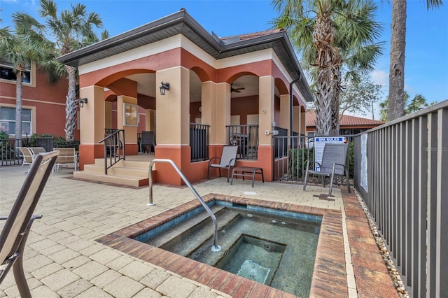 back of house featuring a community hot tub