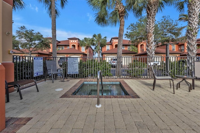 view of pool with a community hot tub