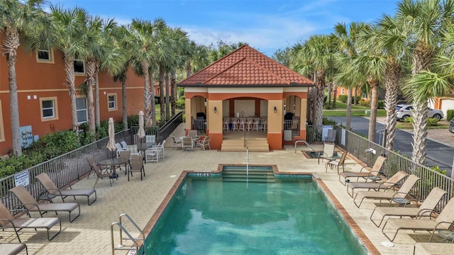 view of swimming pool with a patio area