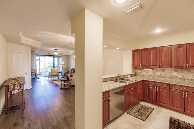 kitchen featuring light stone countertops, ceiling fan, sink, light hardwood / wood-style flooring, and stainless steel dishwasher