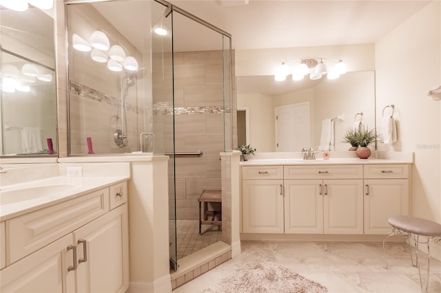 bathroom with a shower with door and vanity