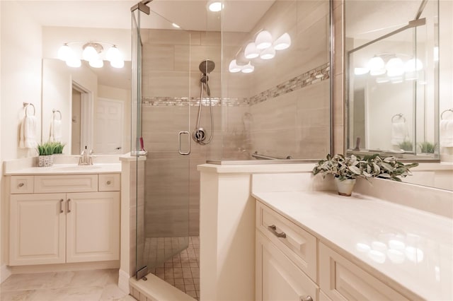 bathroom featuring vanity and an enclosed shower