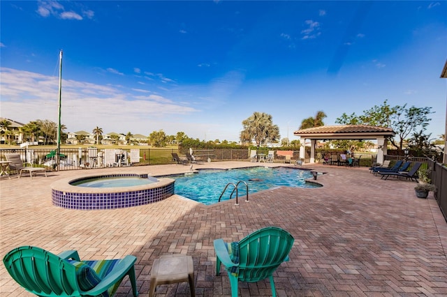 view of pool with a gazebo, a patio area, and a community hot tub