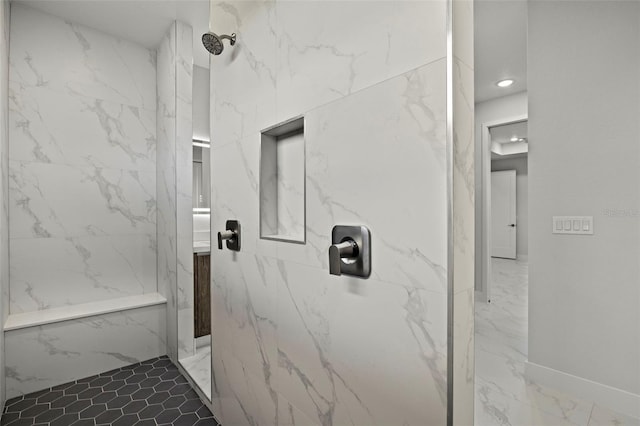 bathroom featuring tiled shower