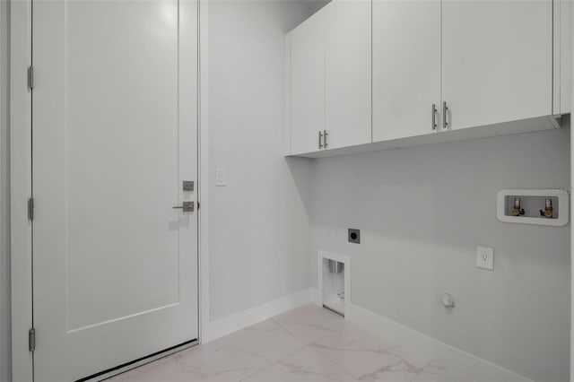 clothes washing area featuring electric dryer hookup, cabinets, and hookup for a washing machine