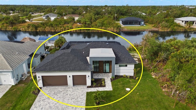 birds eye view of property with a water view