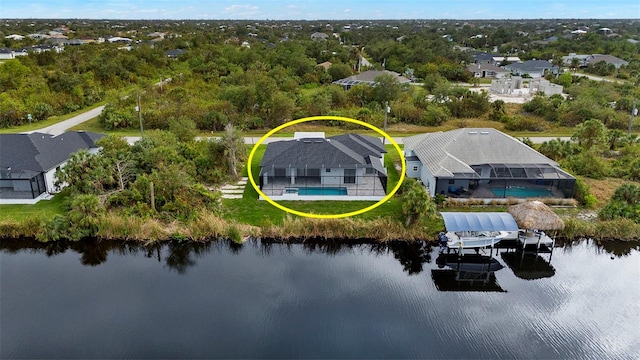 birds eye view of property featuring a water view