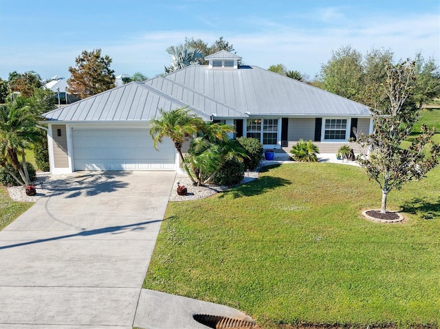 ranch-style home featuring a garage and a front lawn