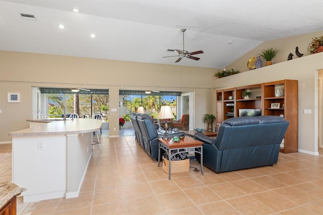 living room featuring light tile patterned floors, high vaulted ceiling, and ceiling fan