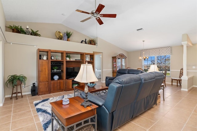 tiled living room with decorative columns, ceiling fan with notable chandelier, and lofted ceiling