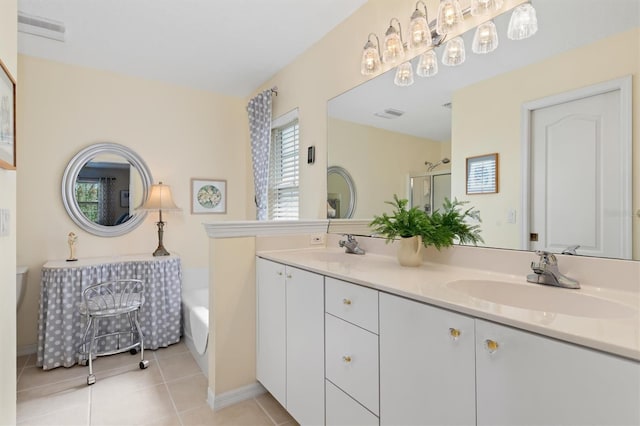 bathroom with plus walk in shower, tile patterned flooring, and vanity