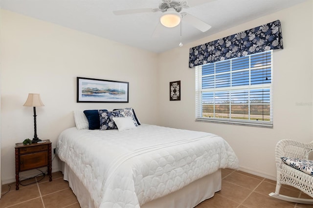 tiled bedroom with ceiling fan