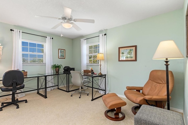 office area with ceiling fan and light colored carpet