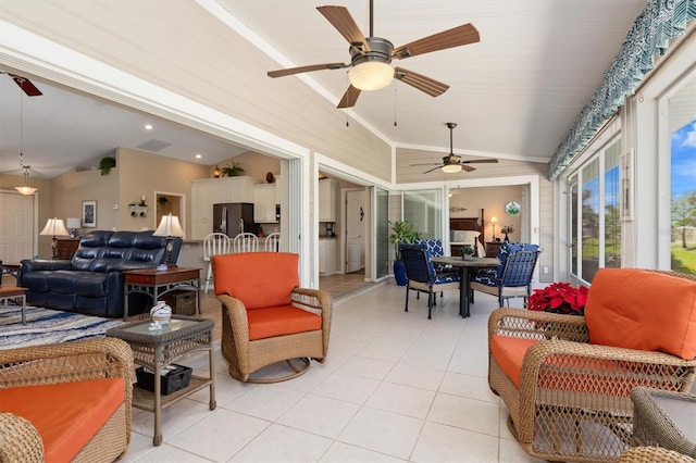 sunroom with vaulted ceiling and ceiling fan