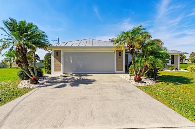 view of front facade featuring a front lawn and a garage