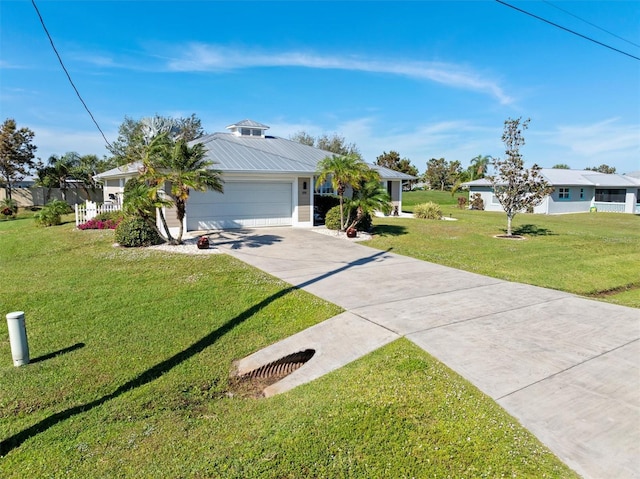 ranch-style house featuring a garage and a front lawn