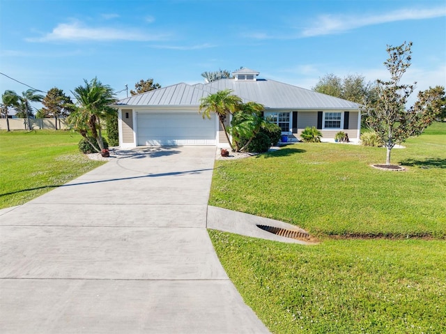 ranch-style house featuring a front yard and a garage