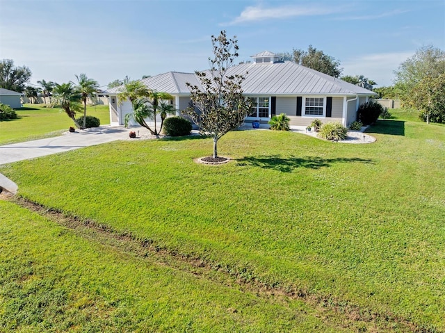 ranch-style home with a garage and a front yard