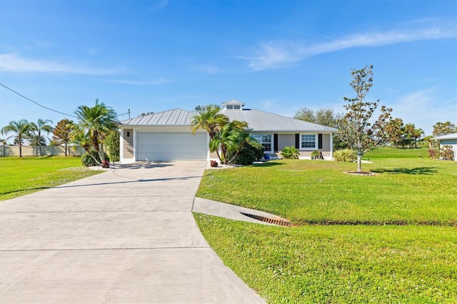 ranch-style home with a garage and a front lawn