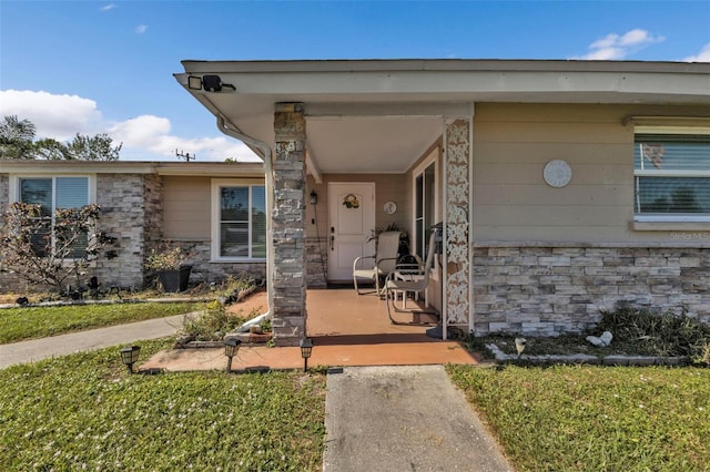 entrance to property with a yard