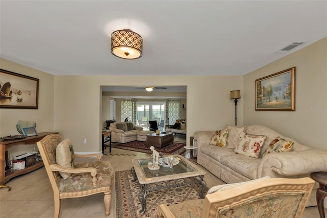 tiled living room featuring ceiling fan