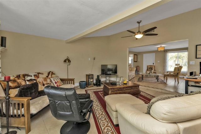 living room featuring beamed ceiling, light tile patterned floors, and ceiling fan