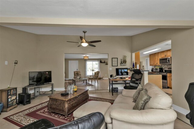 living room featuring ceiling fan and light tile patterned floors