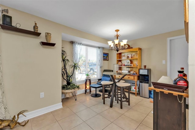 tiled dining room featuring a notable chandelier