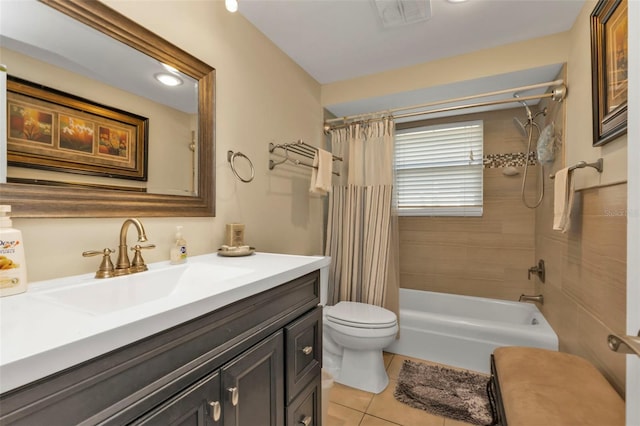 full bathroom with tile patterned floors, vanity, shower / tub combo, and toilet