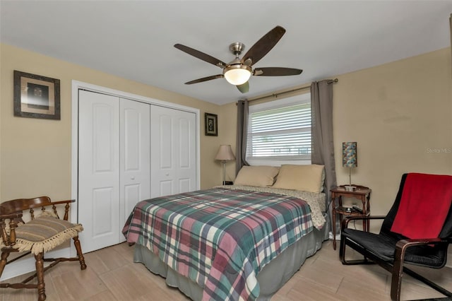 bedroom featuring ceiling fan and a closet