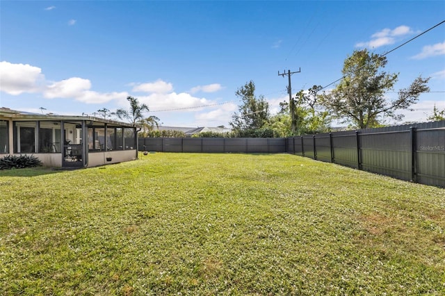 view of yard featuring a sunroom