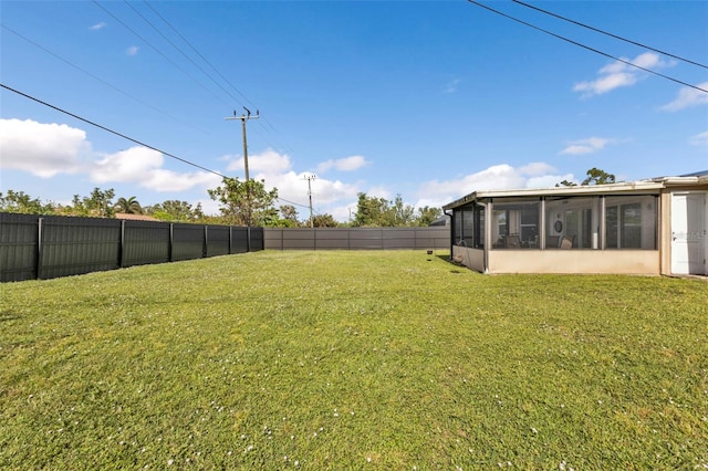 view of yard featuring a sunroom