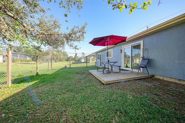 view of yard with a deck