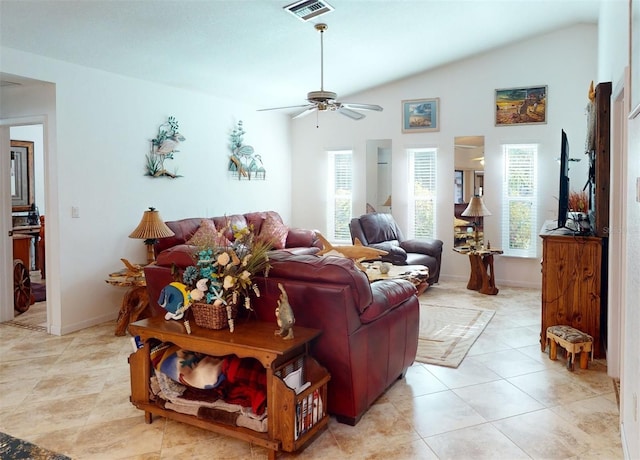 living room with ceiling fan, light tile patterned flooring, and lofted ceiling