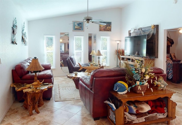 living room featuring ceiling fan, lofted ceiling, and light tile patterned flooring