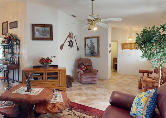 living room featuring vaulted ceiling, ceiling fan, and light tile patterned flooring