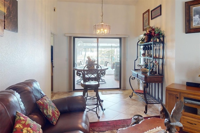 interior space featuring light tile patterned floors and an inviting chandelier