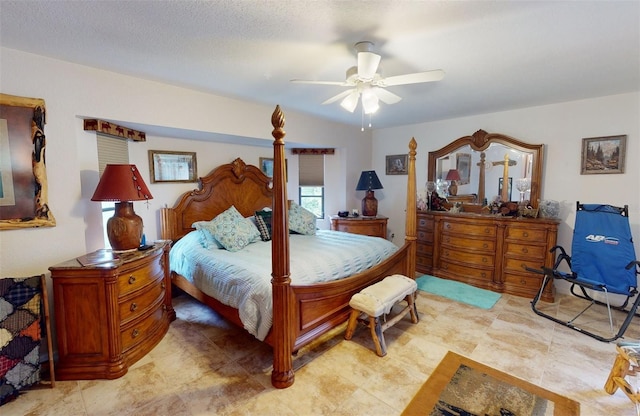 bedroom featuring ceiling fan and a textured ceiling