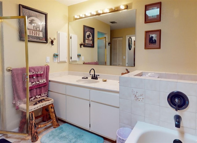 bathroom featuring a bathtub and vanity