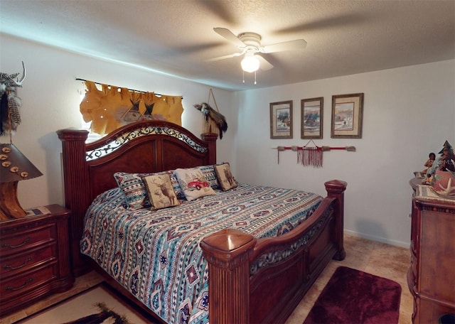 bedroom featuring a textured ceiling and ceiling fan