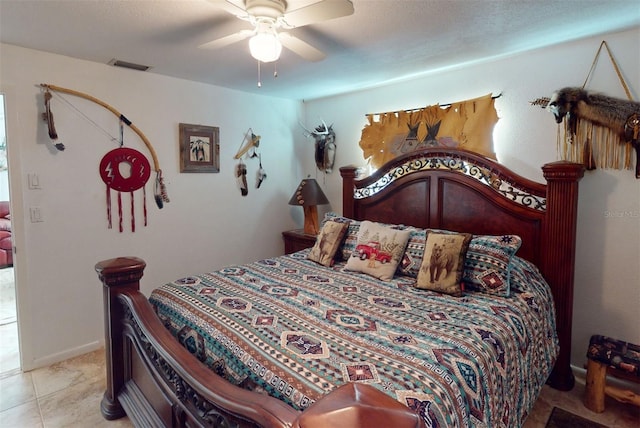 tiled bedroom with ceiling fan