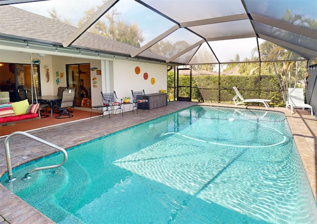 view of pool featuring a lanai and a patio area