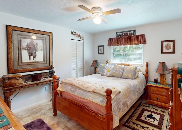 bedroom with ceiling fan, a closet, and a textured ceiling