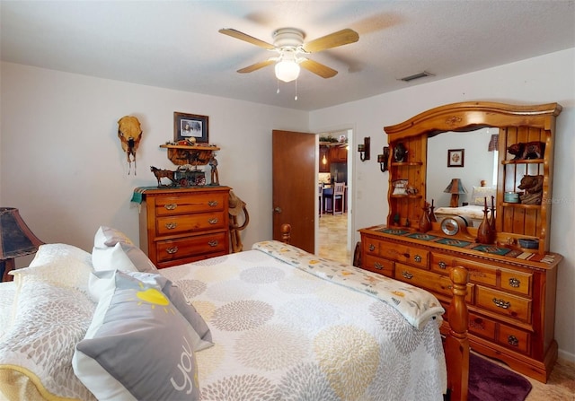 bedroom featuring ceiling fan and light colored carpet