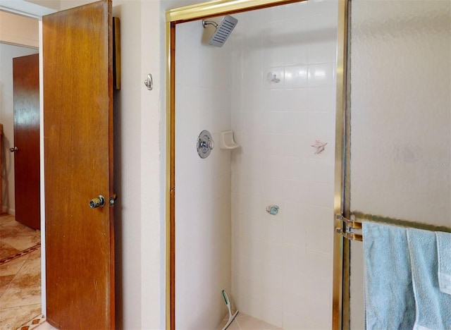 bathroom with tile patterned floors and walk in shower