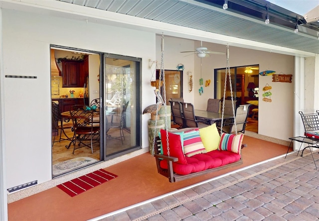 view of patio featuring ceiling fan